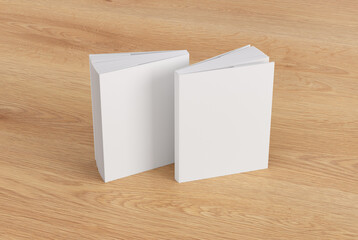 Two softcover or paperback vertical white mockup books standing on the wooden background. Blank front and back cover - obrazy, fototapety, plakaty