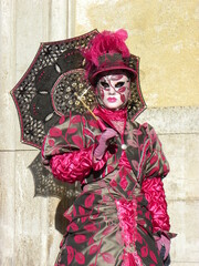 Fototapeta na wymiar Pink beige costume venetian carnival mask