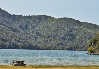 Fototapeta na wymiar Lakeside Picnic Table with Mountain Backdrop in New Zealand
