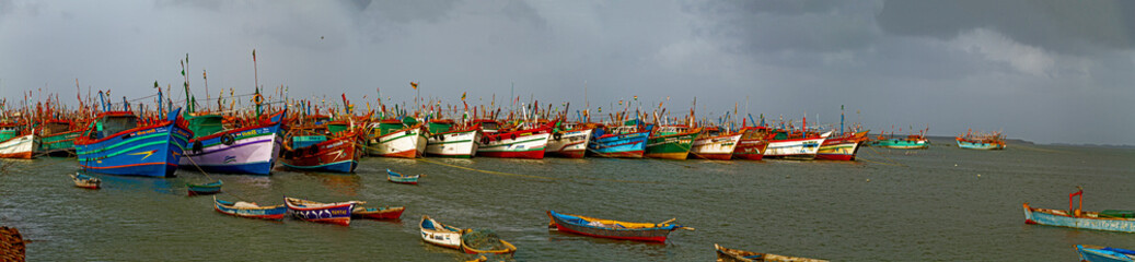 Fototapeta na wymiar Panorama of fishing trawlers off Dwarka Coast in Gujarat India