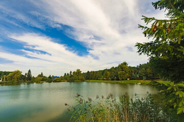 Obraz premium nature photography landscape summer clear weather morning time pond reservoir with green trees scenic environment space June