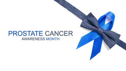 Blue ribbon cancer. Awareness prostate cancer of men health in November. Blue ribbon, fashion bowtie isolated on white background. Symbol of oncology affected man. Copy space.
