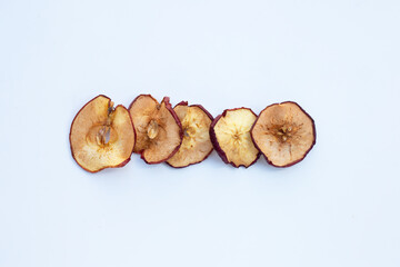 Dried apple slices on white background
