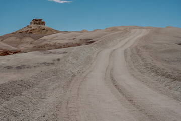 Fototapeta na wymiar Eroded Dirt Road over Hill