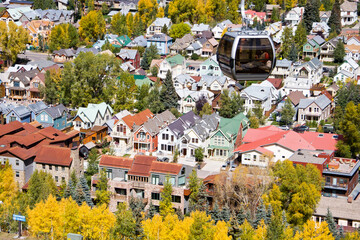 Telluride Gondola Car -Autumn aerial view of a Gondola Car with Telluride homes in the San Juan mountains of southwestern Colorado, San Miguel County © Jon Camrud