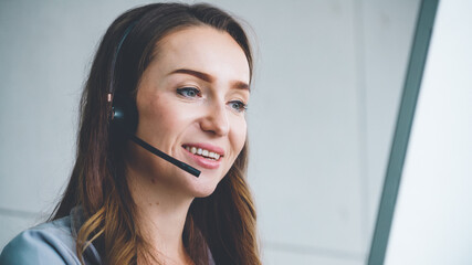 Business people wearing headset working in office to support remote customer or colleague. Call...