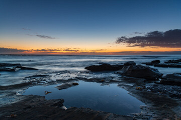 Rocky coastline sunrise seascape