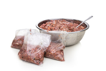 Minced barf raw food recipe for dogs consisting meat, organs, fish, eggs and vegetable are packaged for freezing