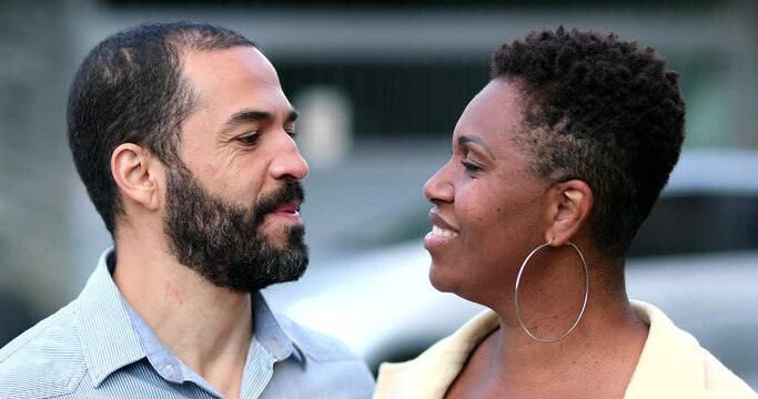 Mixed race couple kissing each other. Interracial husband and wife kiss