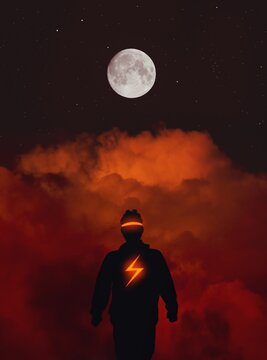 Digital Composite Image Of Silhouette Man Standing Against Cloudy Sky At Night