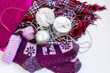 Christmas socks, package, and gifts on white background