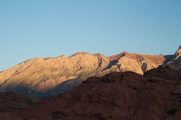 Desert landscape. Beautiful view of the red sandstone, canyon, valley and mountains at sunset in Talampaya national park in La Rioja, Argentina.