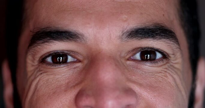 Wrinkled man opening eyes smiling at camera. Macro close-up man in 40s feeling relaxed