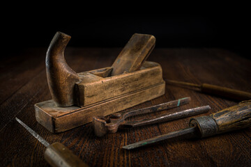 Old carpentry tools on a wooden table