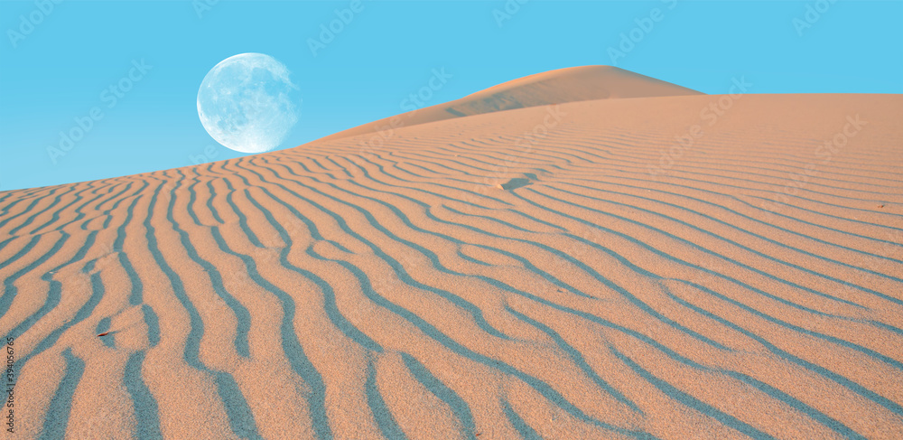 Poster full moon rising during sunlight at the desert 