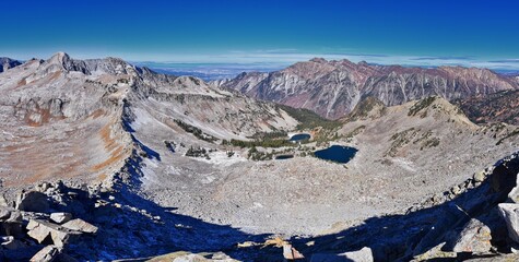 Red Pine Lake mountain landscape scenic view from White Baldy and Pfeifferhorn hiking trail, towards Little Cottonwood Canyon, Wasatch Rocky mountain Range, Utah, United States. 