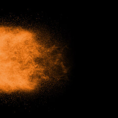 Brown powder explosion isolated on black background.