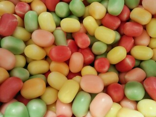 Close up view of colorful gummy jelly beans, Candy background.