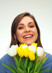 happy woman holding bouquet of tulips in front of.