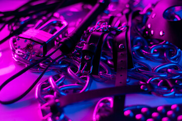 Set of erotic toys for BDSM. The game of sexual slavery with a whip, gag and leather blindfold. Intimate sex games