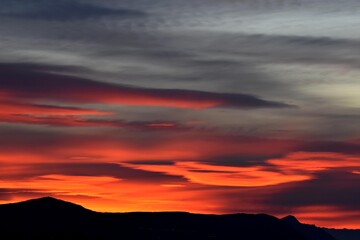 Morning sky over the roofs. Sunrise. Urban landscape. Dawn. Daybreak. Sunset/ Dark beautiful sunset