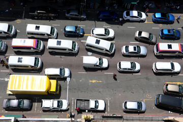 South African traffic jam in urban city street with traditional taxis