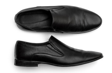Pair of black classic leather shoes on white.