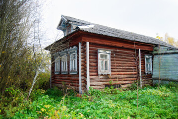 An old wooden hut in a remote village. The house was built a hundred years ago.