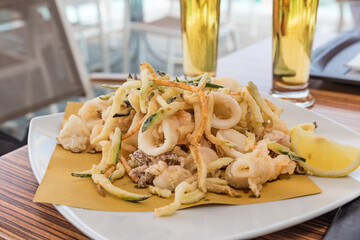 Fried mixed fish with ice-cold beer