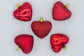 five red hearts on white background