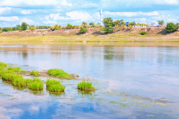 Natural scenery with riverside . Village situated on the river shore 