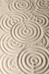 Fototapeta na wymiar Sand surface texture with circles and shadows, for relaxation and spiritual harmony