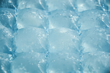 Blue plastic packaging ice bags for home water freezing. Ice cubes in plastic bag, freezer for ice...