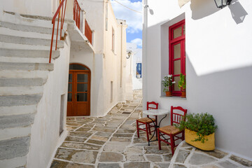 Fototapeta na wymiar A view of whitewashed street with typical Greek architecture in Lefkes village on Paros Island, Cyclades, Greece