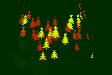 Bokeh in the shape of a Christmas tree. New year background. Selective focus