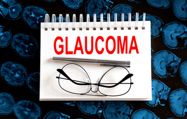 Text GLAUCOMA on a mri background. Nearby are various medicines. Medical concept.