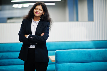 Gorgeous indian woman wear formal posing at cafe.