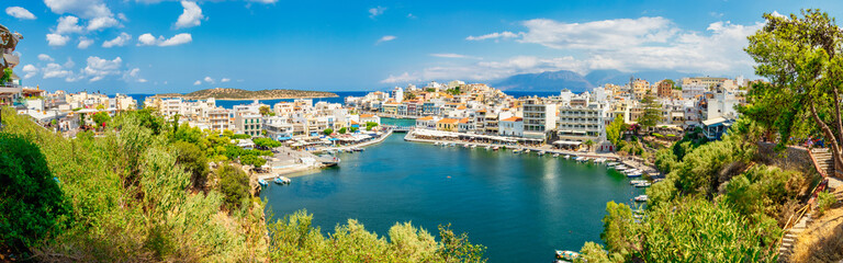 Fototapeta na wymiar Agios Nikolaos, Greece - August 9, 2020 - View of the bay of Agios Nikolaos with the famous port