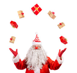 Santa Claus juggles Christmas gifts. Santa Claus throws xmas box isolated on a white background.