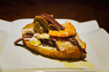 Bar food skewer with anchovy