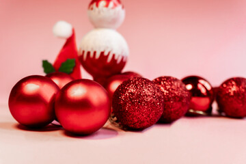 Christmas Background Christmas Toys and Decorations Red  Christmas Balls Cones on Pink Background.