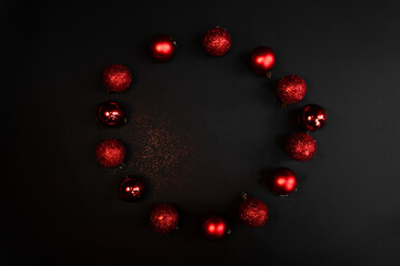 Christmas composition. red Christmas toys in a circle with sequins