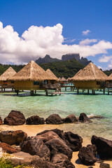 beach hut in coral lagoon in bora bora luxury resort honeymoon in french polynesia 
