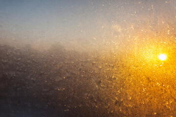 Fototapeta na wymiar Beautiful Closeup Winter Window Pane Coated Shiny Icy Frost Patterns
