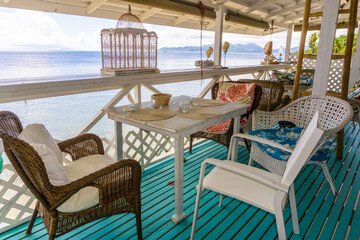table and chairs on the terrace on the beach