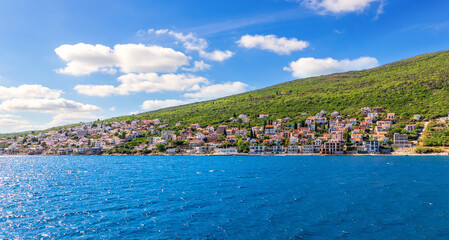 Fototapeta na wymiar Villages on the coast in the Kotor bay, Adriatiac sea, Montenegro