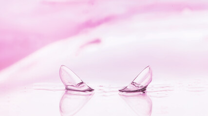 Tools for vision correction. Glasses and lenses with diopters on the background of splashes and blurry.