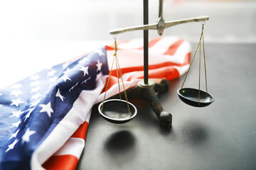 United States Law, scales of justice and American flag. Concept. Money.