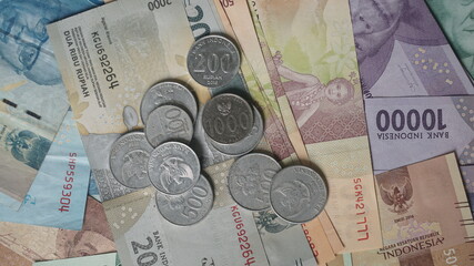 Rupiah banknotes and coins. Money or Currency