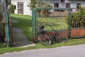 Old bicycle in a small village in rural area of Mazowsze region of Poland